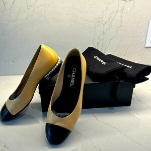 Adorable authentic CHANEL slip on shoes in classic tan and black colour